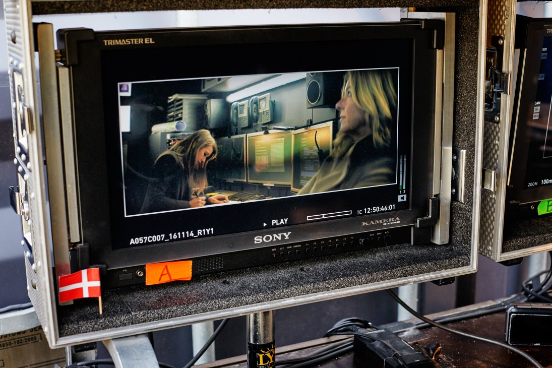 Sara Hjort Ditlevsen and Paprika Steen in a subway control room scene from Below the Surface displayed on a production monitor.