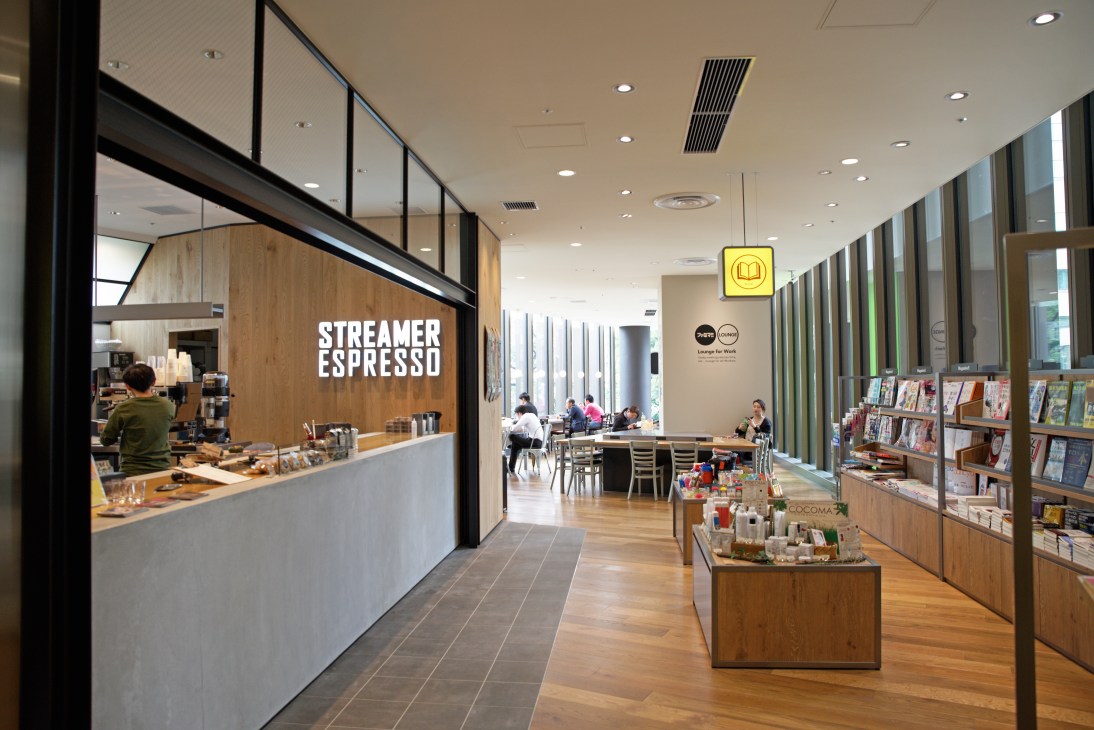 Streamer Espresso café counter with seating area and FamilyMart convenience store section in Tokyo Garden Terrace.