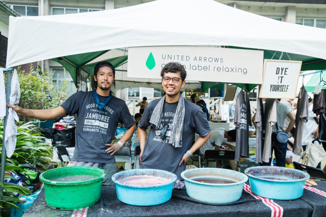 Dyeing artisan Yukihito Kanai and colleague at United Arrows stall with dye basins at Good Neighbors Jamboree.