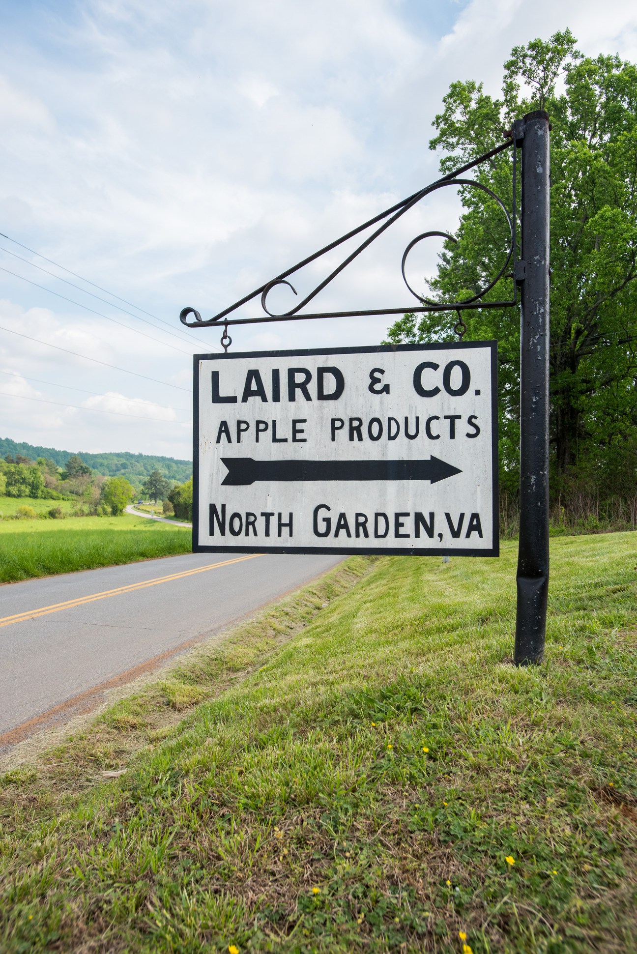 Laird & Co Apple Products directional sign on a rural Virginia road near North Garden.
