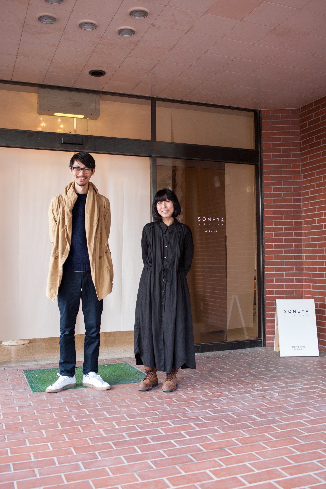 Nanako and Kohei Suzuki standing outside their Someya Atelier storefront in Nishi Awakura, Japan.
