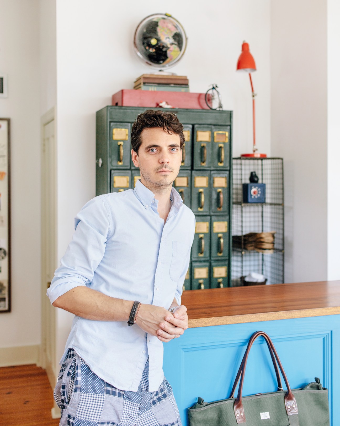 Brett Carron poses at the counter of his Indigo and Cotton menswear shop in Charleston's Cannonborough neighbourhood.