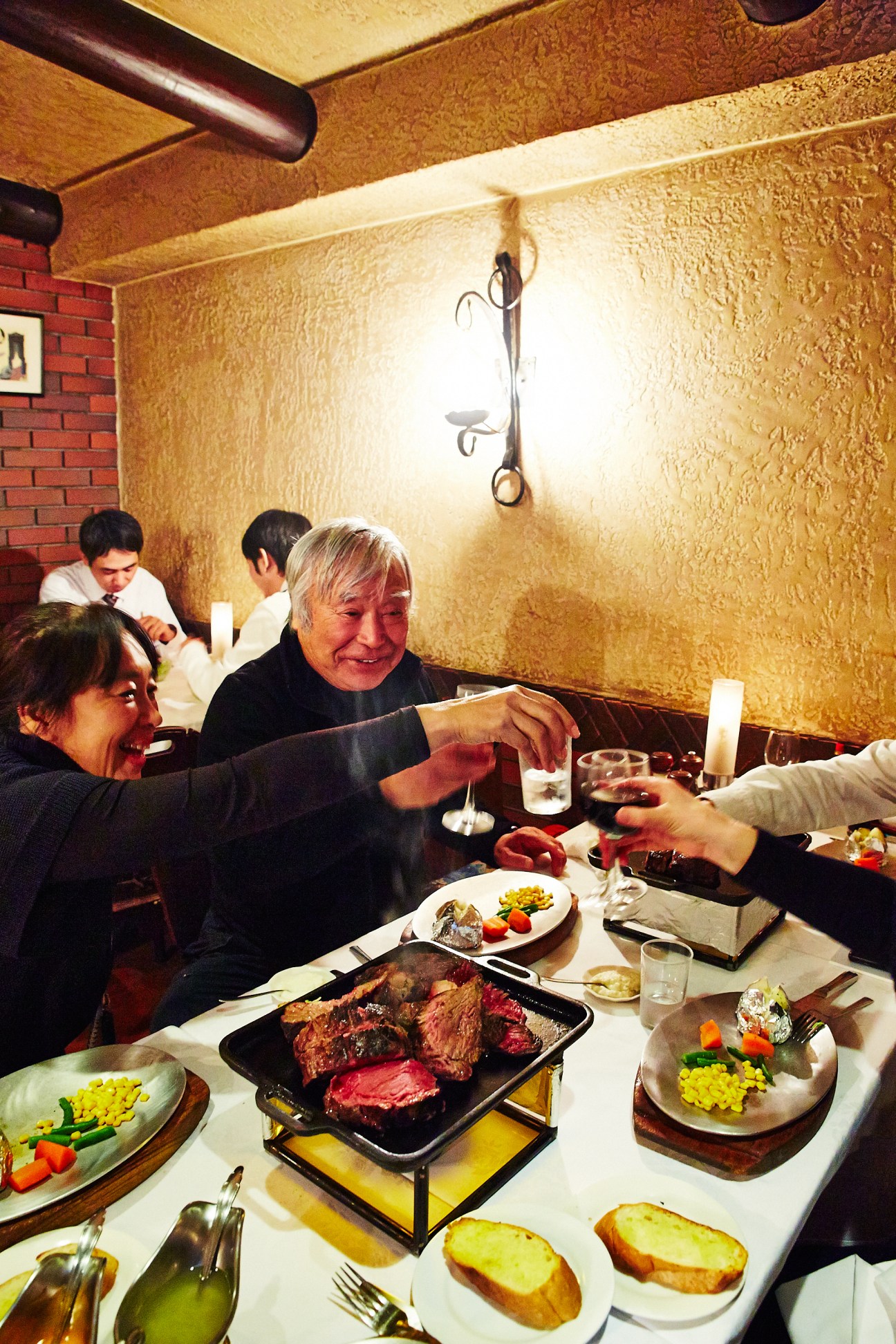 Yuichiro Miura and his daughter Emili dining at Chaco Amemiya steakhouse in Tokyo.