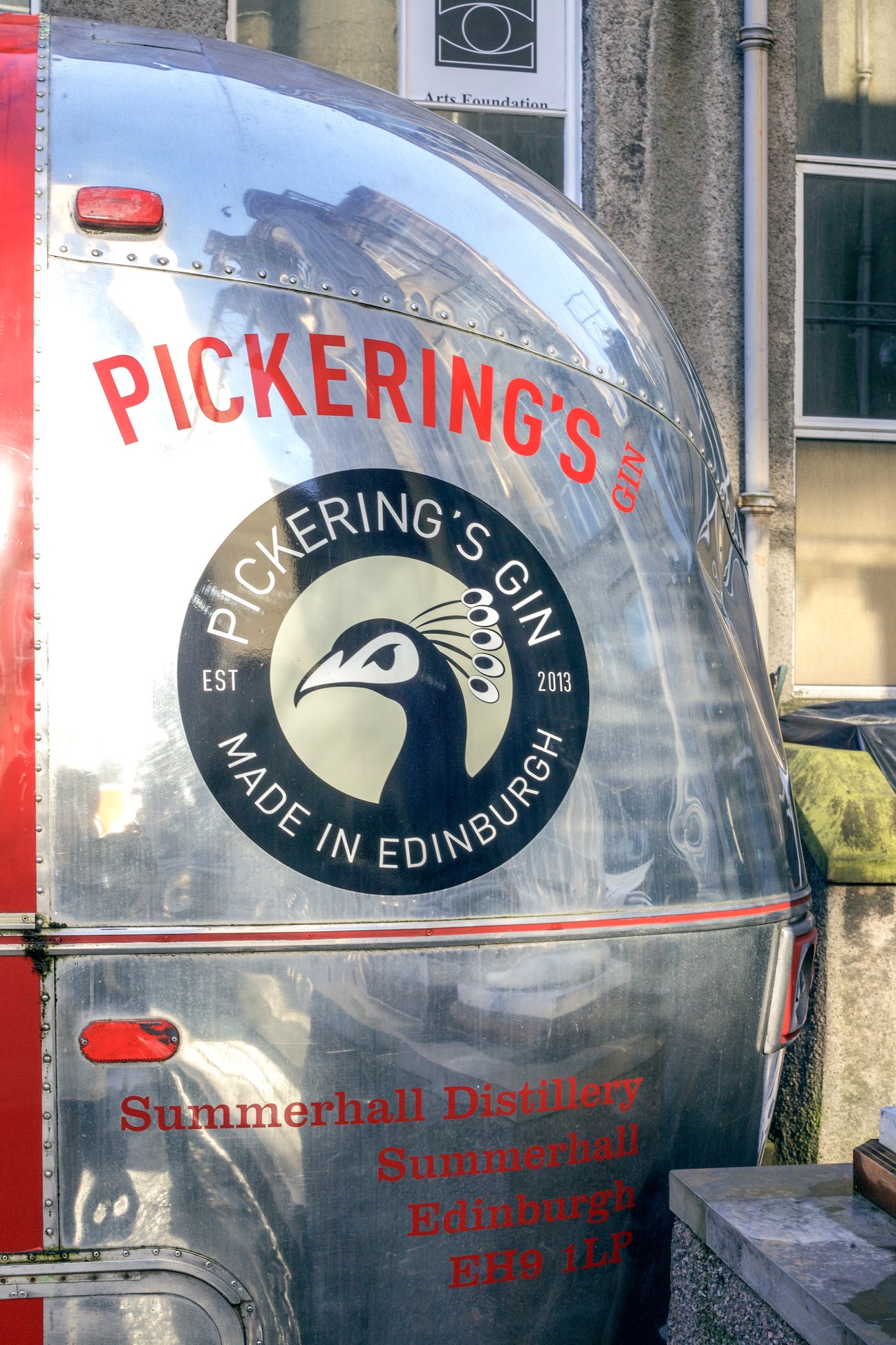 Pickering's Gin trailer with peacock logo and red text on silver Airstream, Made in Edinburgh.