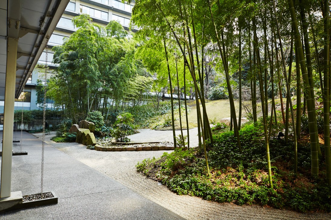 Japanese garden courtyard with bamboo, moss, and raked pebbles at the Ministry of Foreign Affairs headquarters in Tokyo.