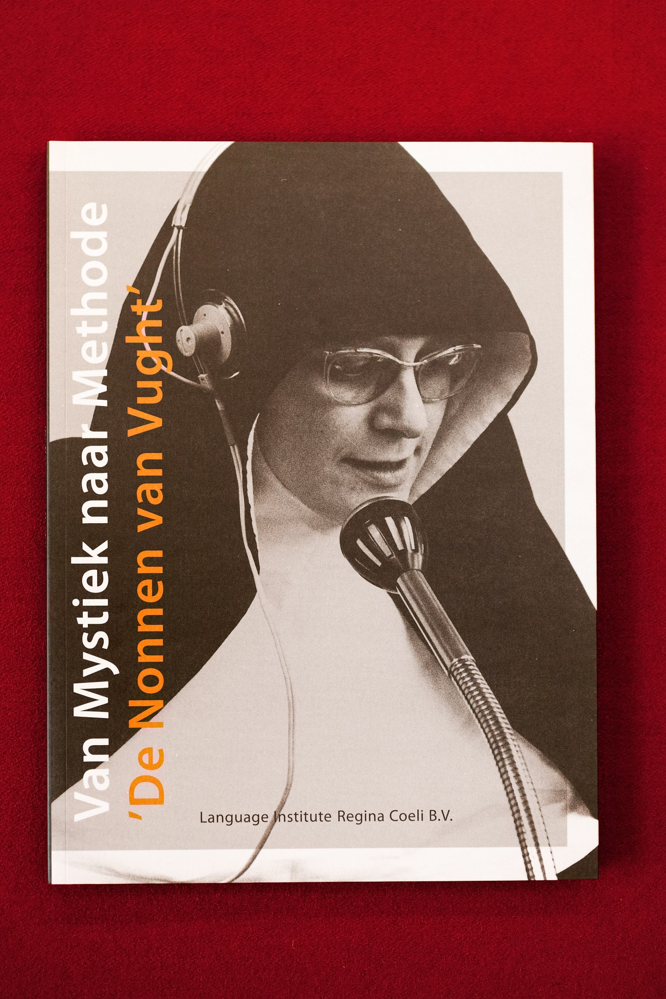 Vintage Regina Coeli language institute brochure with nun wearing headphones and glasses on red background