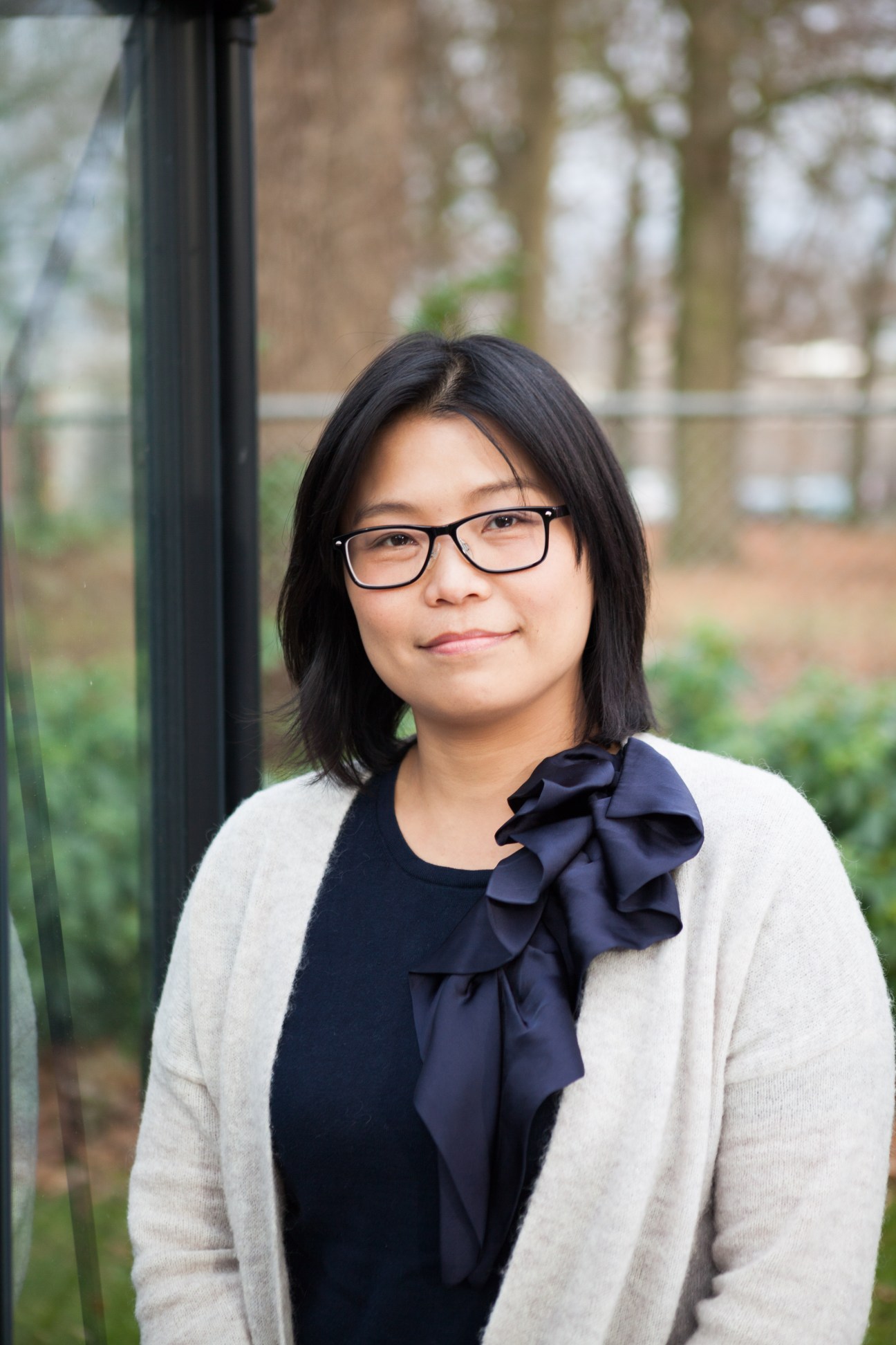 Taiwan-born Mandarin teacher Ying-chun Lin wearing glasses and a navy bow tie