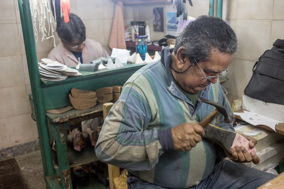 Craftsman carefully handmaking a tango shoe in the Gretaflora factory in Buenos Aires.