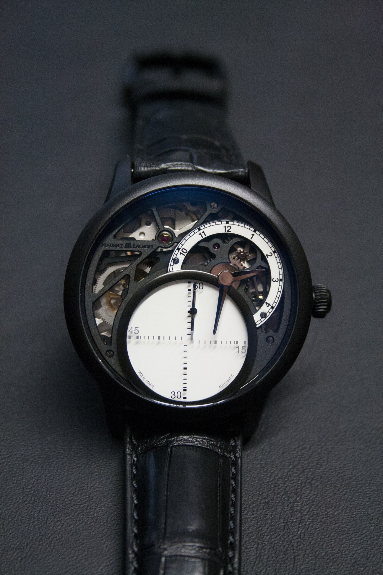 Maurice Lacroix Masterpiece Seconde Mystérieuse watch with off-centre time display and rotating seconds hand.