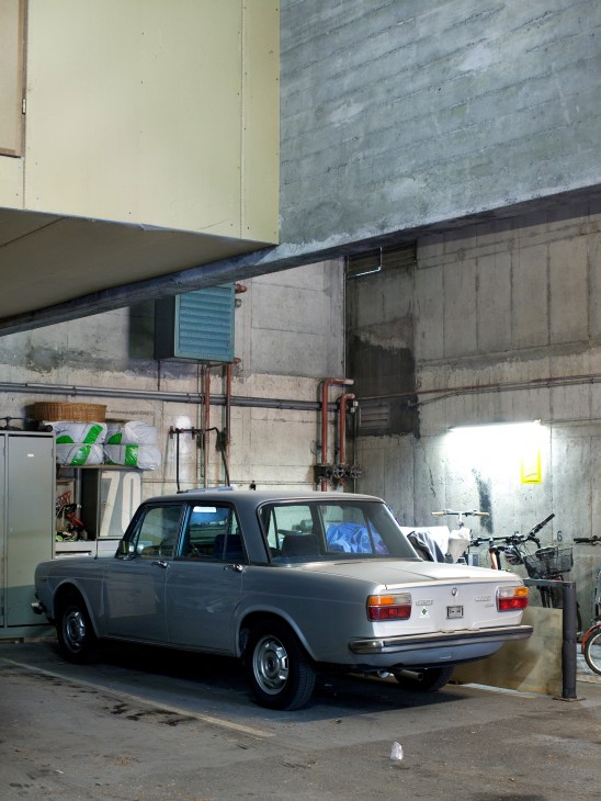 Underground parking area showing individual parking spaces for each house