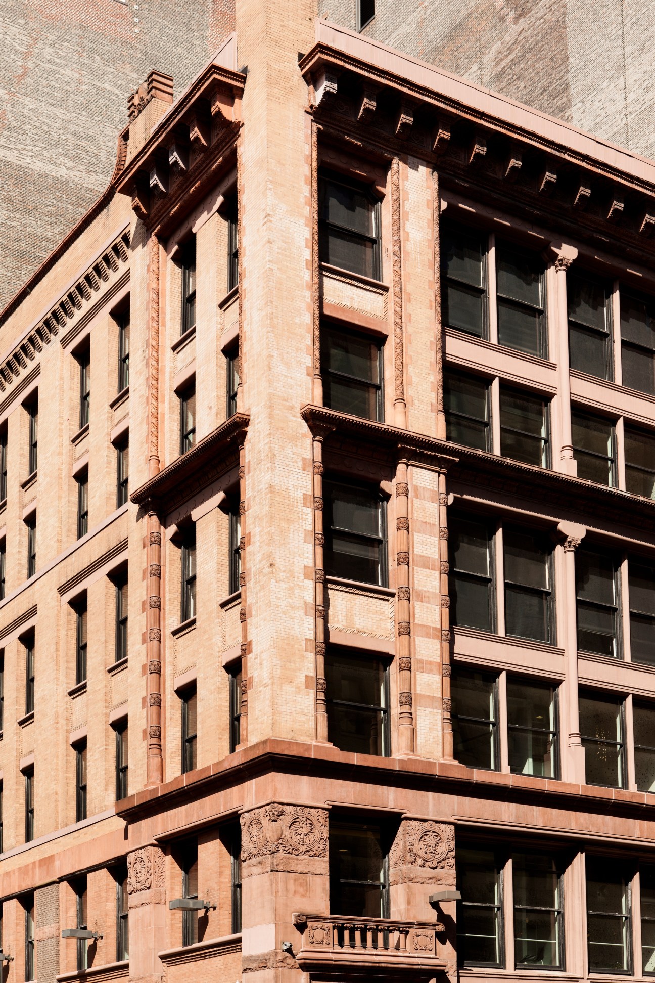 Red-brick NYU Philosophy Department building exterior on corner of Mercer Street and Washington Place.