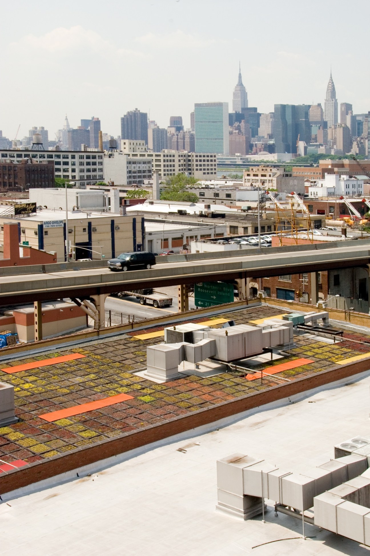 Green roof with planted succulents at Silvercup TV Studios in Queens, New York, with Manhattan skyline in background.