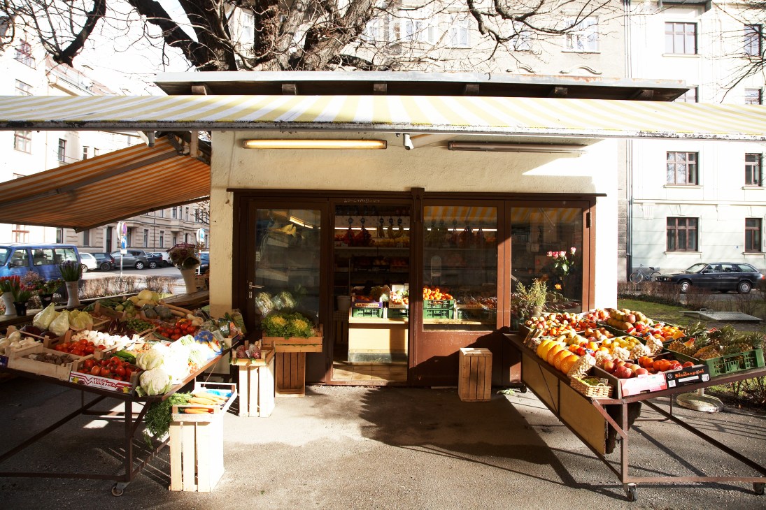 Obststand Bachman greengrocer in Innsbruck with fruit and vegetable displays outside a storefront.