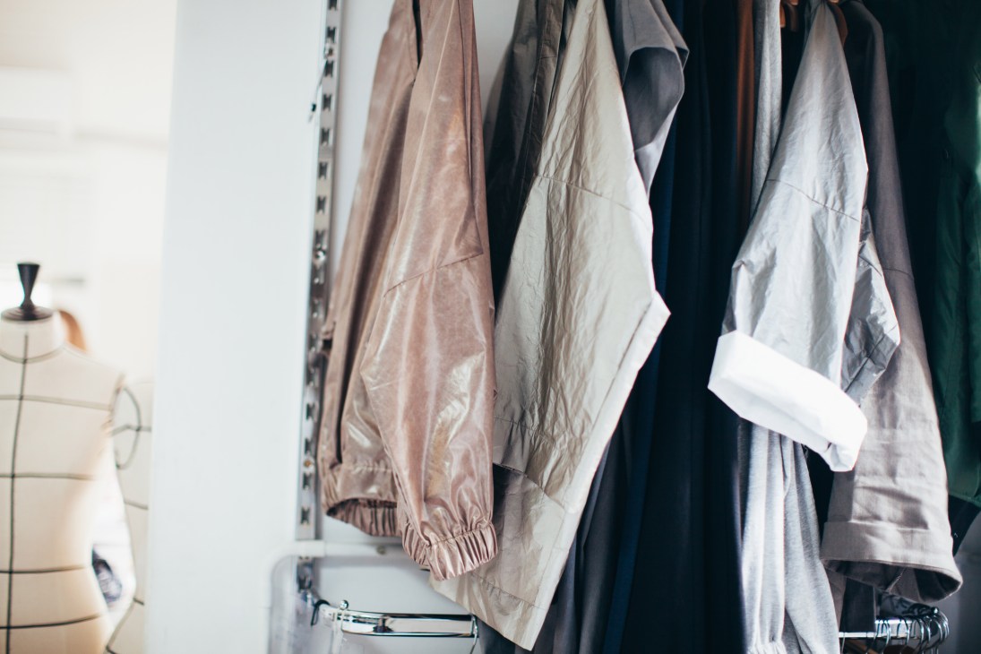 Garments hanging on a rack at Creative Space, a fashion training school in Beirut.