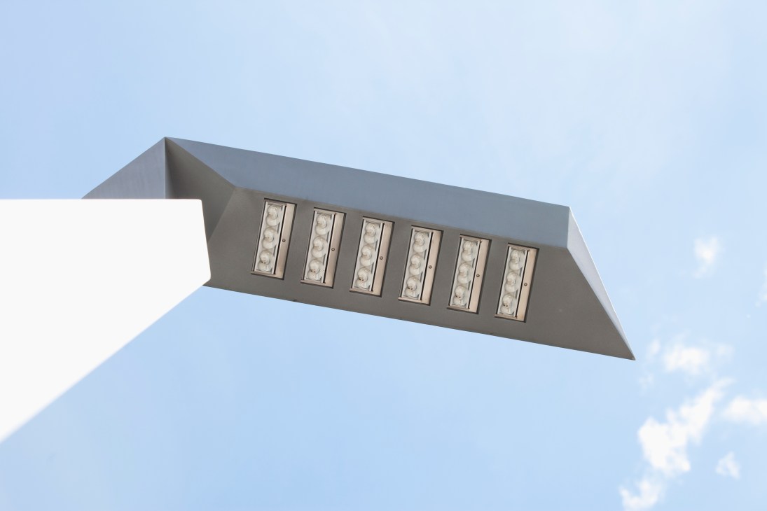 Ewo's Tagliente prototype street lamp with geometric design and multiple LED modules mounted on white pole against blue sky