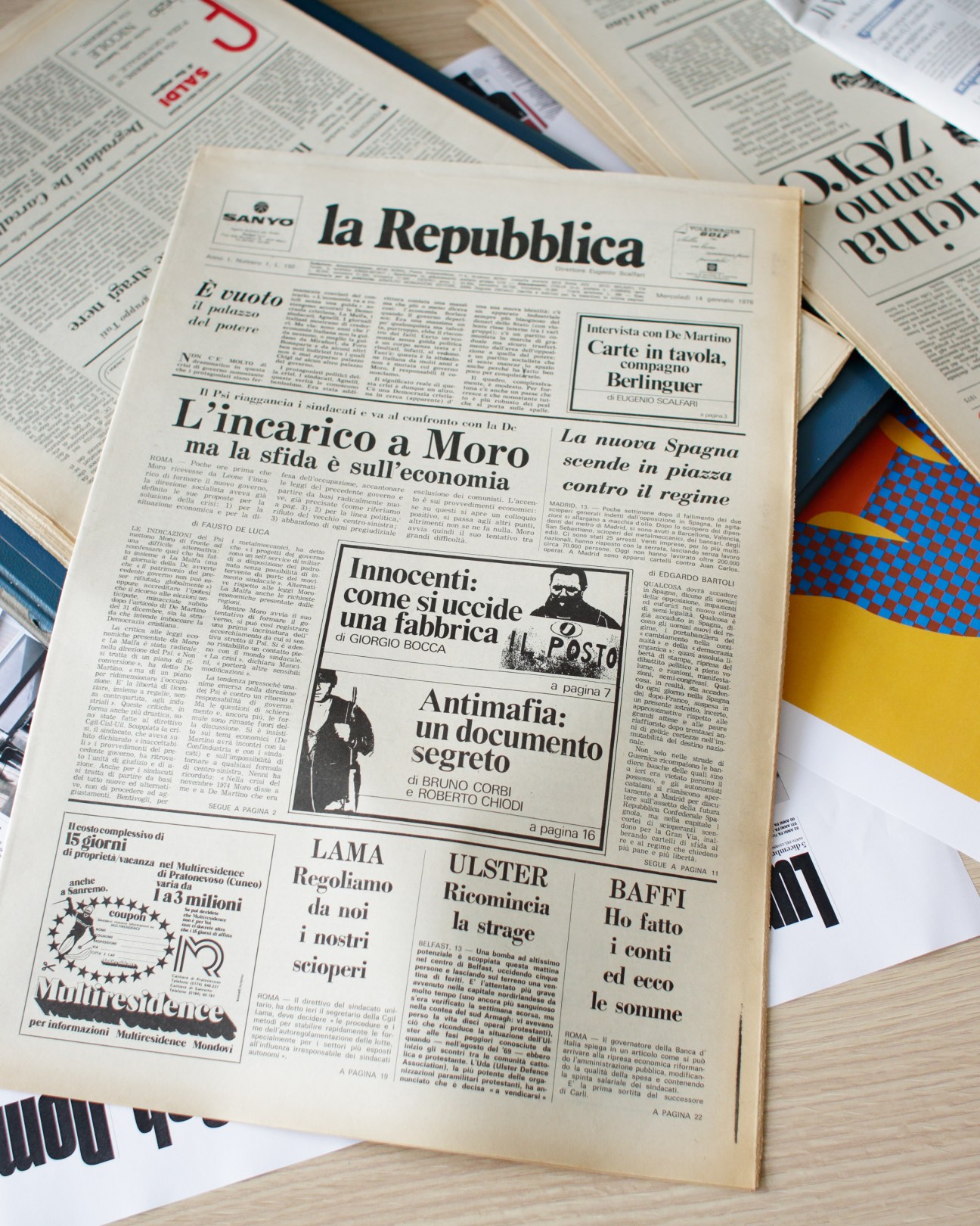 Archival newspaper pages of La Repubblica showing vintage layout and typography from 1976 mock-up edition.