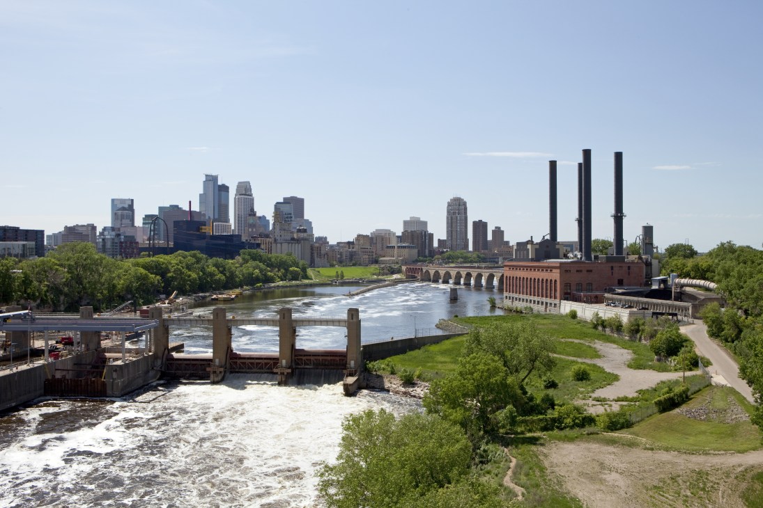 Saint Anthony Falls Lower Lock and Dam on the Mississippi River with Minneapolis skyline in background.