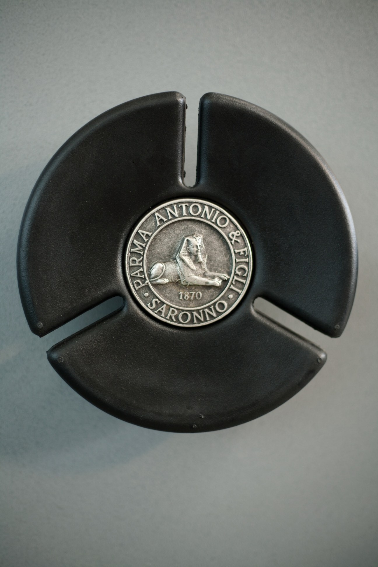 Parma Antonio & Figli logo featuring a Great Sphinx of Giza emblem on dark metal.