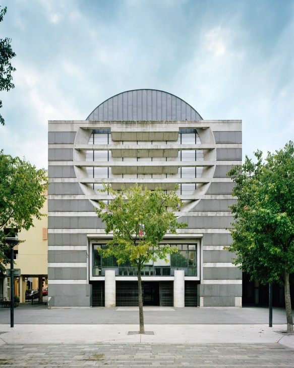 Geometric concrete church and town hall building with curved dome roof at Sophia Antipolis.