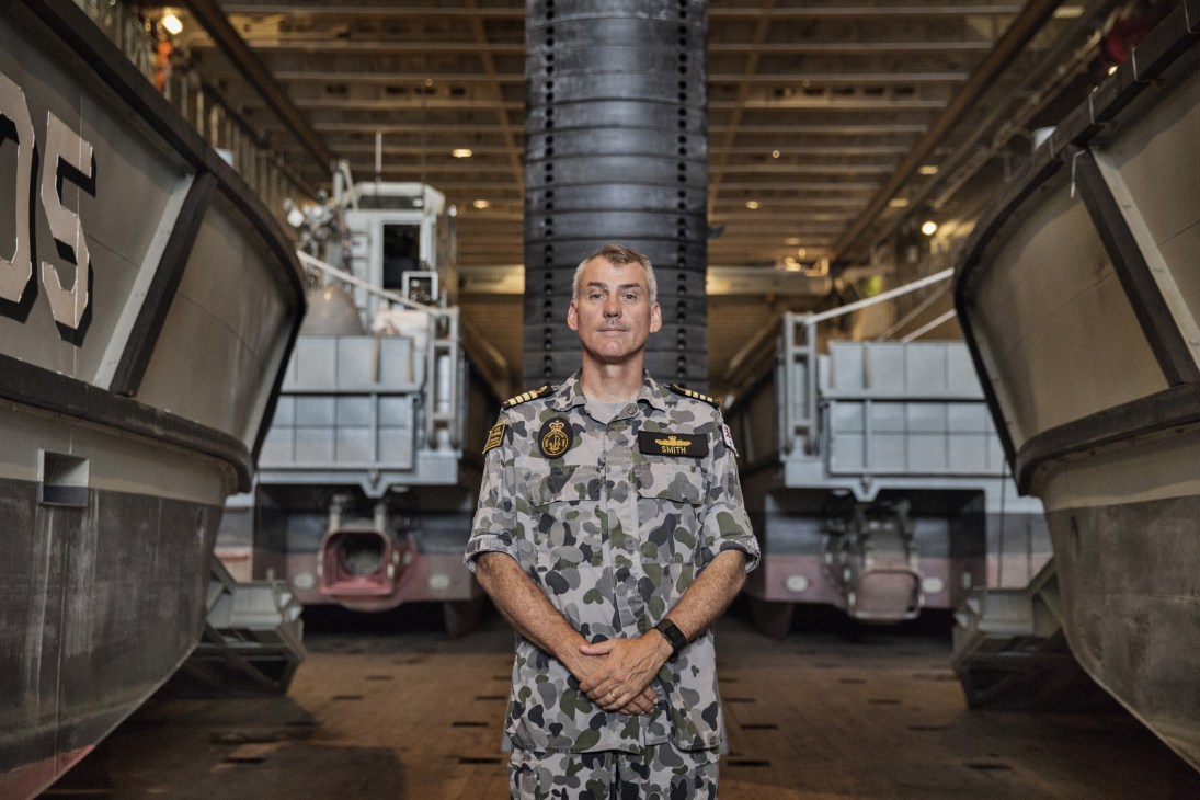 Captain Christopher Smith standing in the amphibious landing dock of HMAS Canberra.