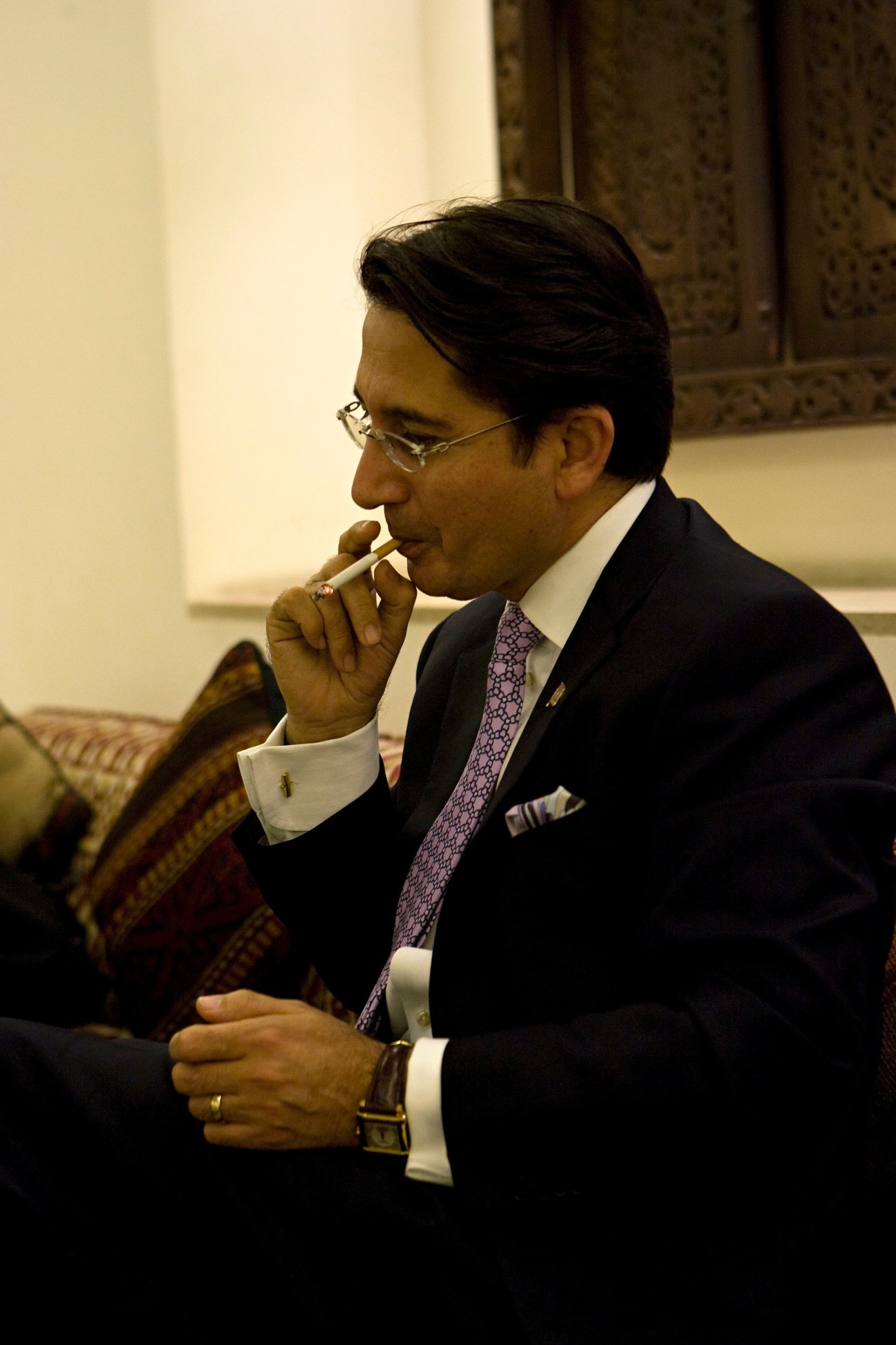 Said Jawad, Afghan ambassador to Washington, sits in the Serena hotel tea room in Kabul, thoughtfully touching his face.