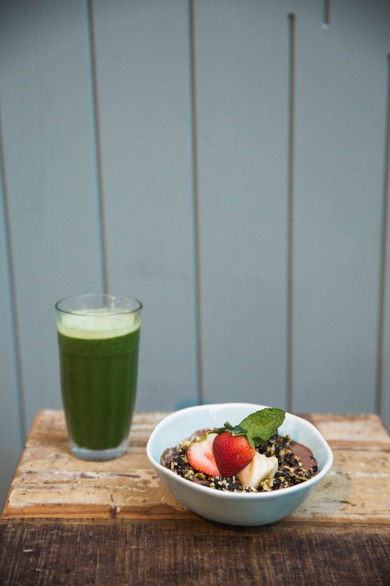 Green smoothie and granola bowl with strawberry and mint at Grassroots on Hollywood Road.