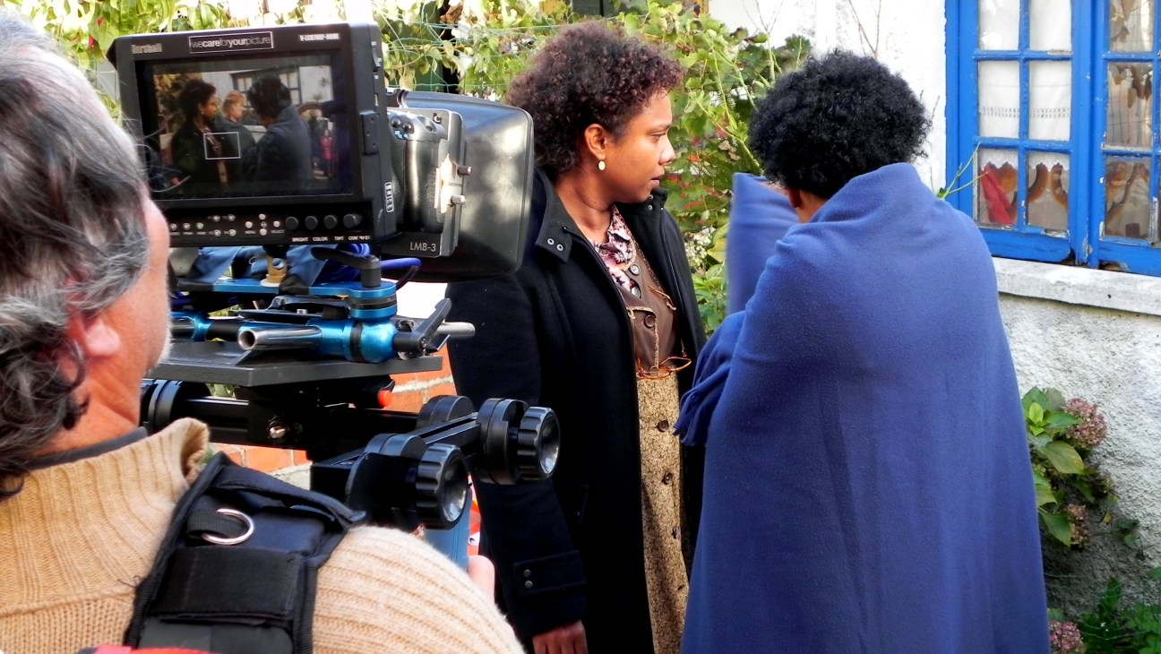 Film director Pocas Pacoal on set with camera crew during production of a film.