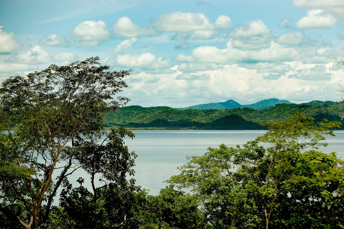 Turquoise water and verdant rainforest landscape at Andaz Papagayo resort in Costa Rica.