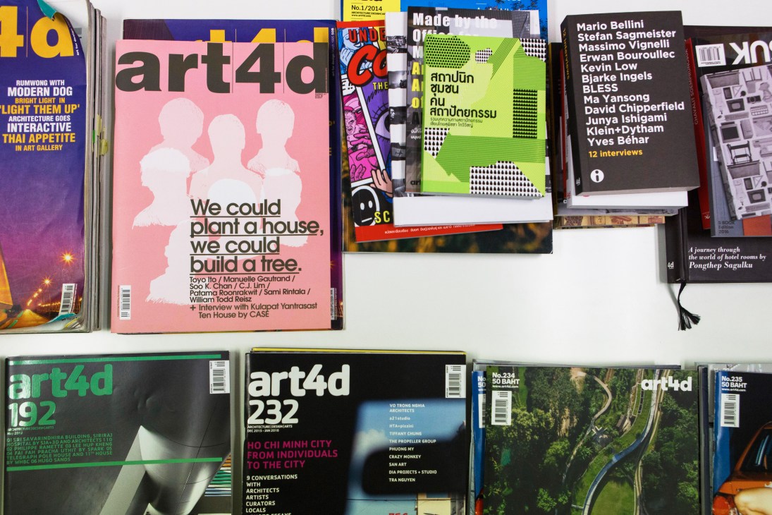 Stack of Art4d magazines displayed on a shelf with colorful covers featuring design and architecture content