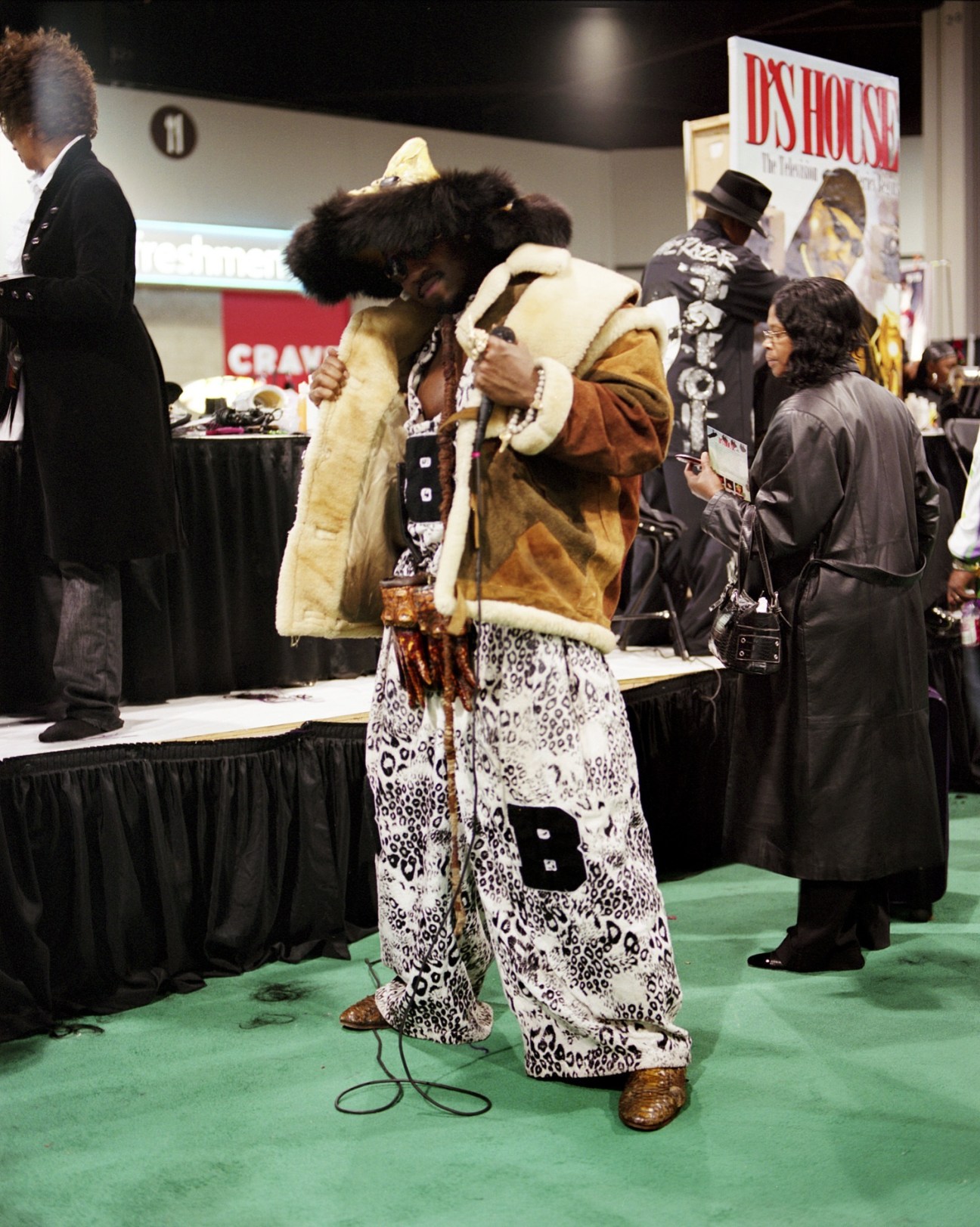 Big Bad D wears a tan fur-lined jacket and leopard-print pants at the Bronner Brothers Hair Show.
