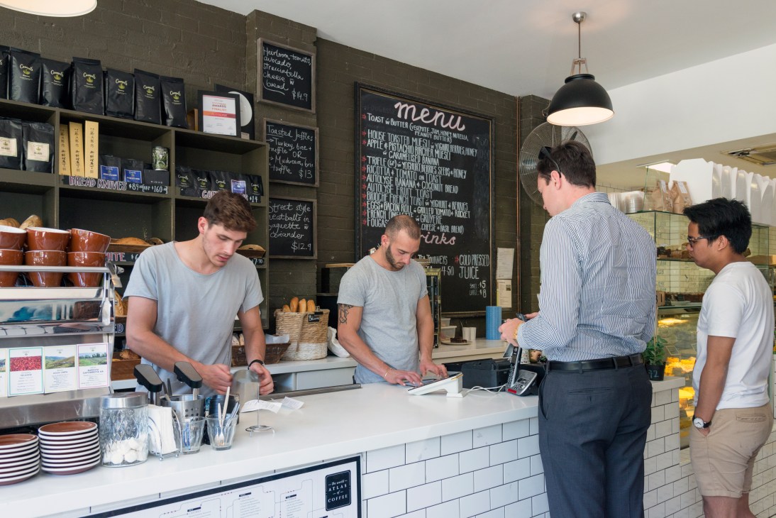 Customers queue at the counter at Autolyse Bakery and Café in Braddon, Canberra.