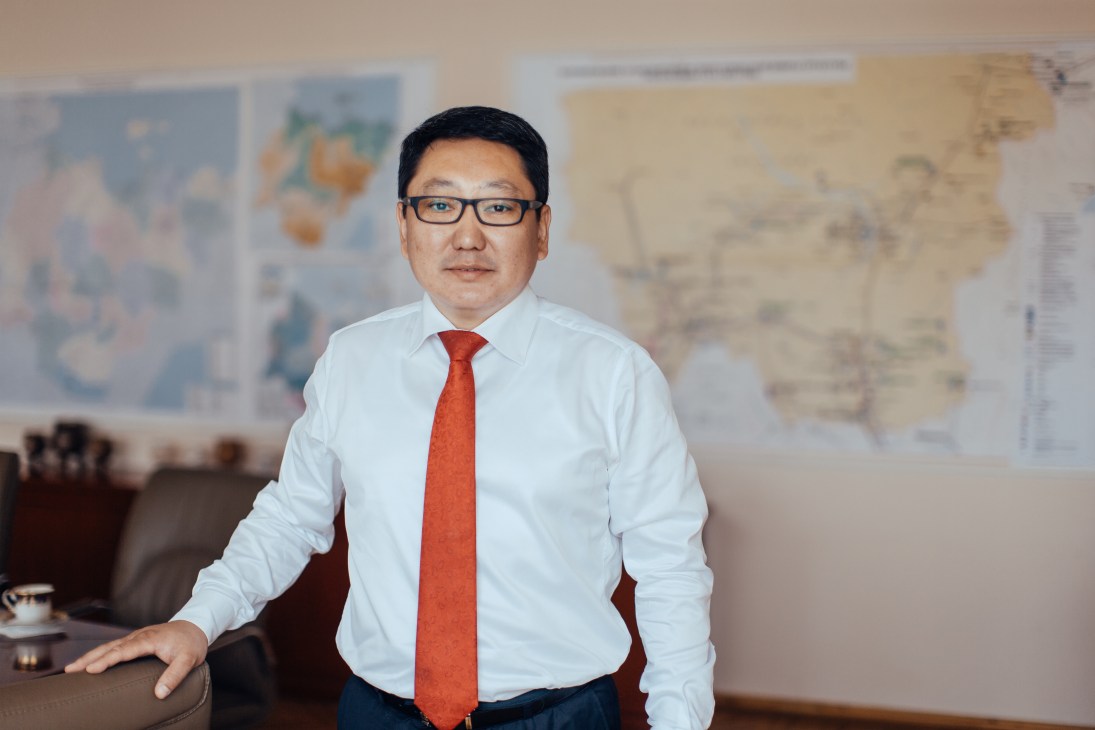 Valeriy Maximov, Yakutia's minister of economic development, in an office with maps on the wall