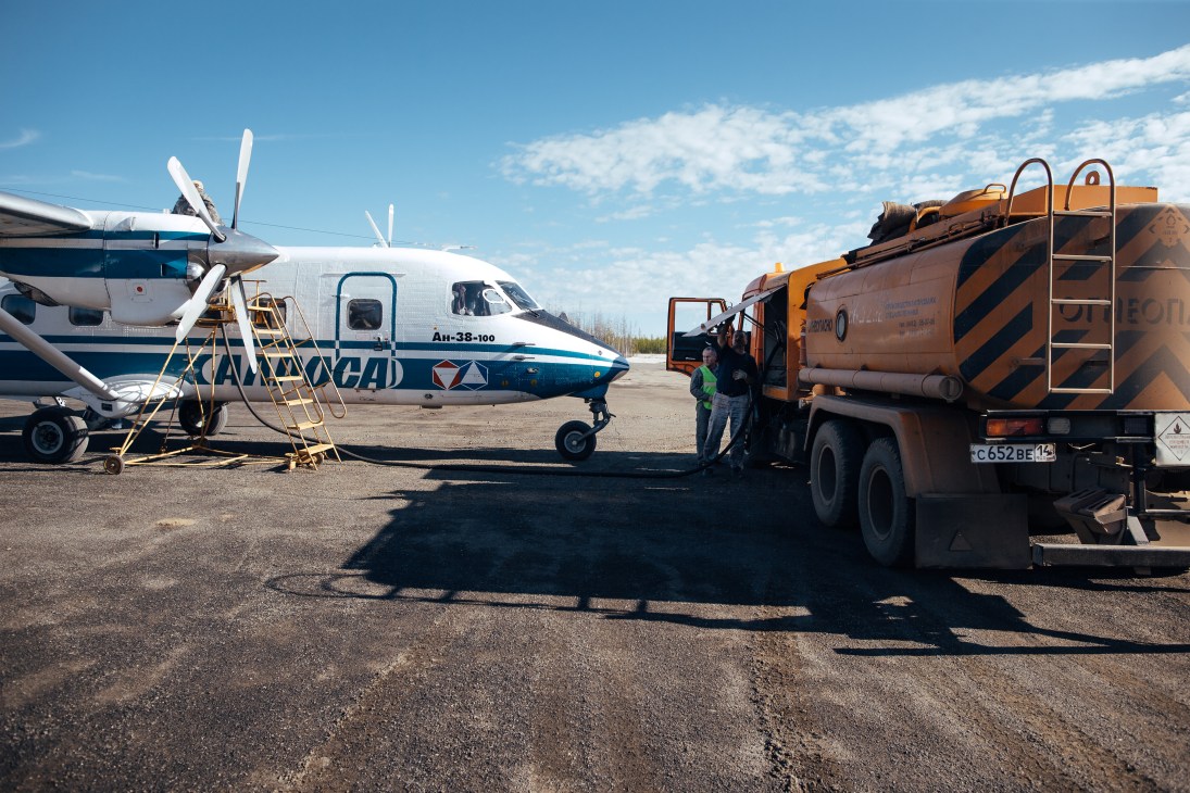 An-38 plane being refuelled by a tanker truck at an airport in Nakyn, Yakutia.