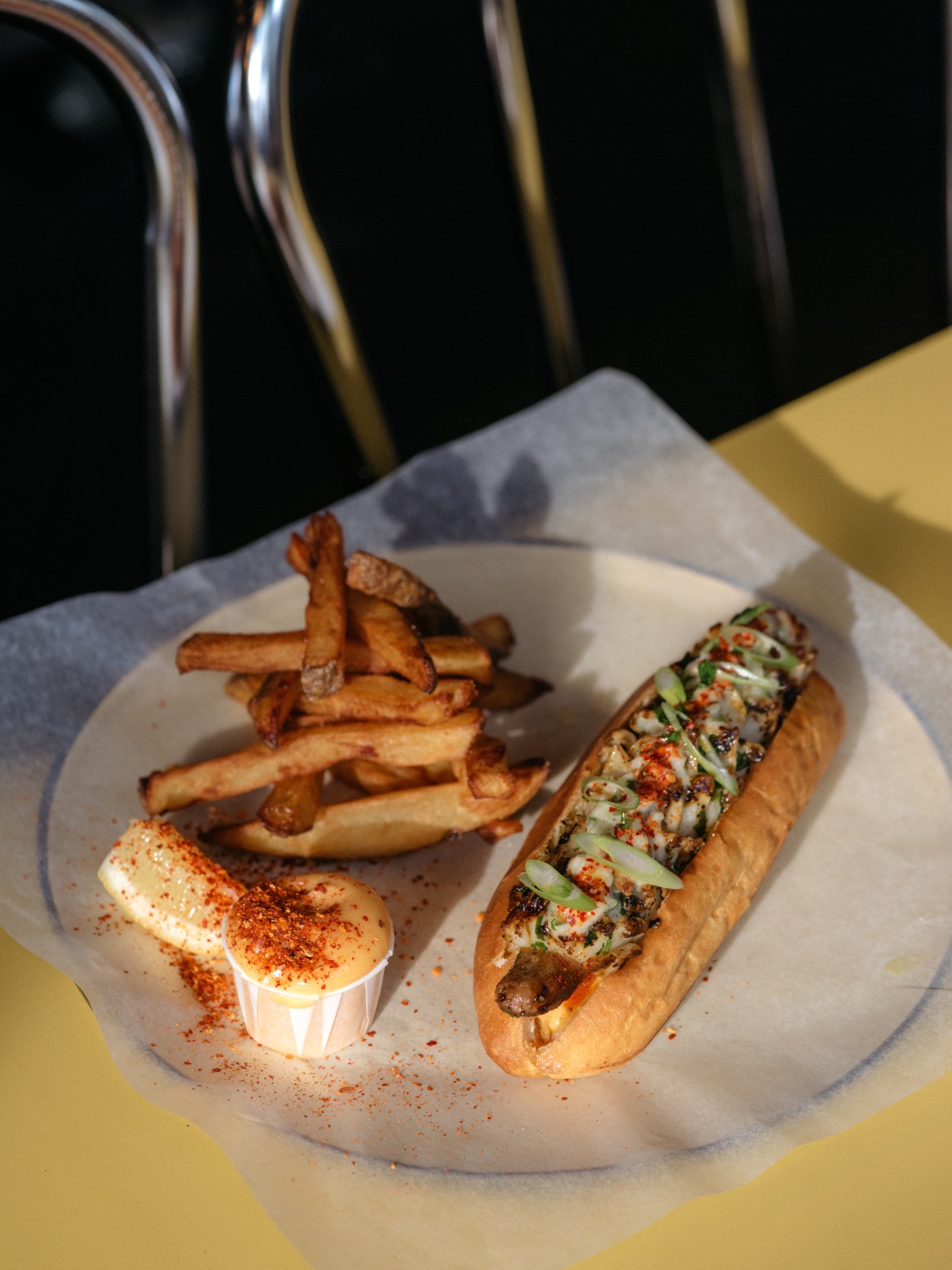 Squid-roll merguez hotdog with fries and aioli at Mile-Ex restaurant in Montreal.