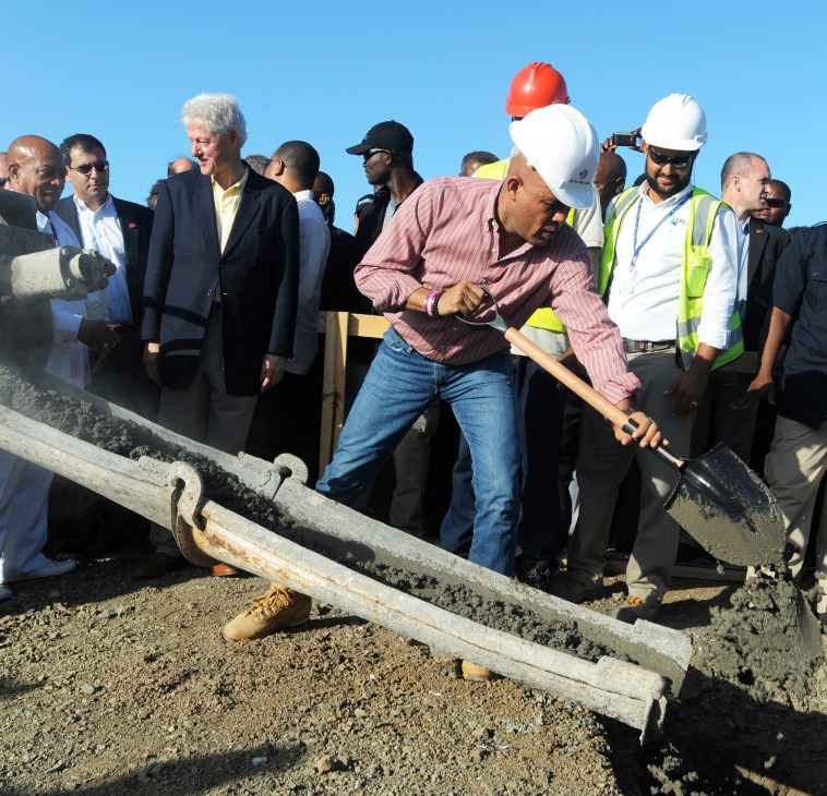 Officials and construction workers at a groundbreaking ceremony for Haiti's industrial park development.