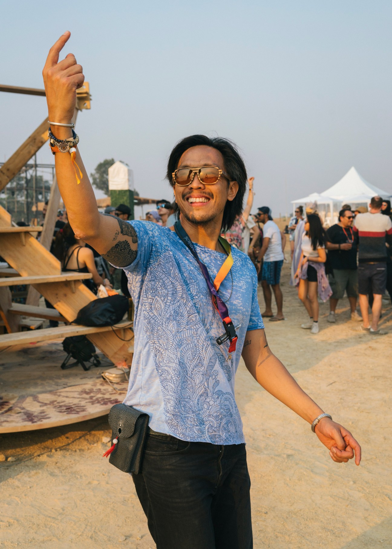 Festival organiser Pete smiles and raises his fist in celebration at Wonderfruit festival in Thailand.
