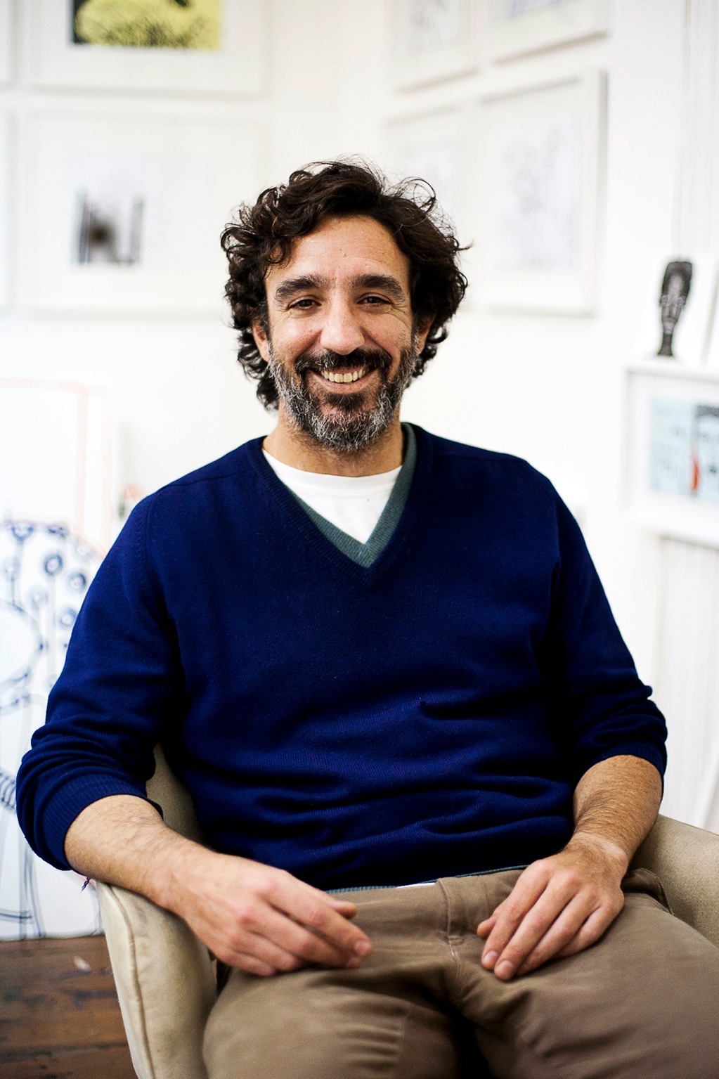 Polo Pflücker, a Barranco resident and artist, smiling in a bright interior space.