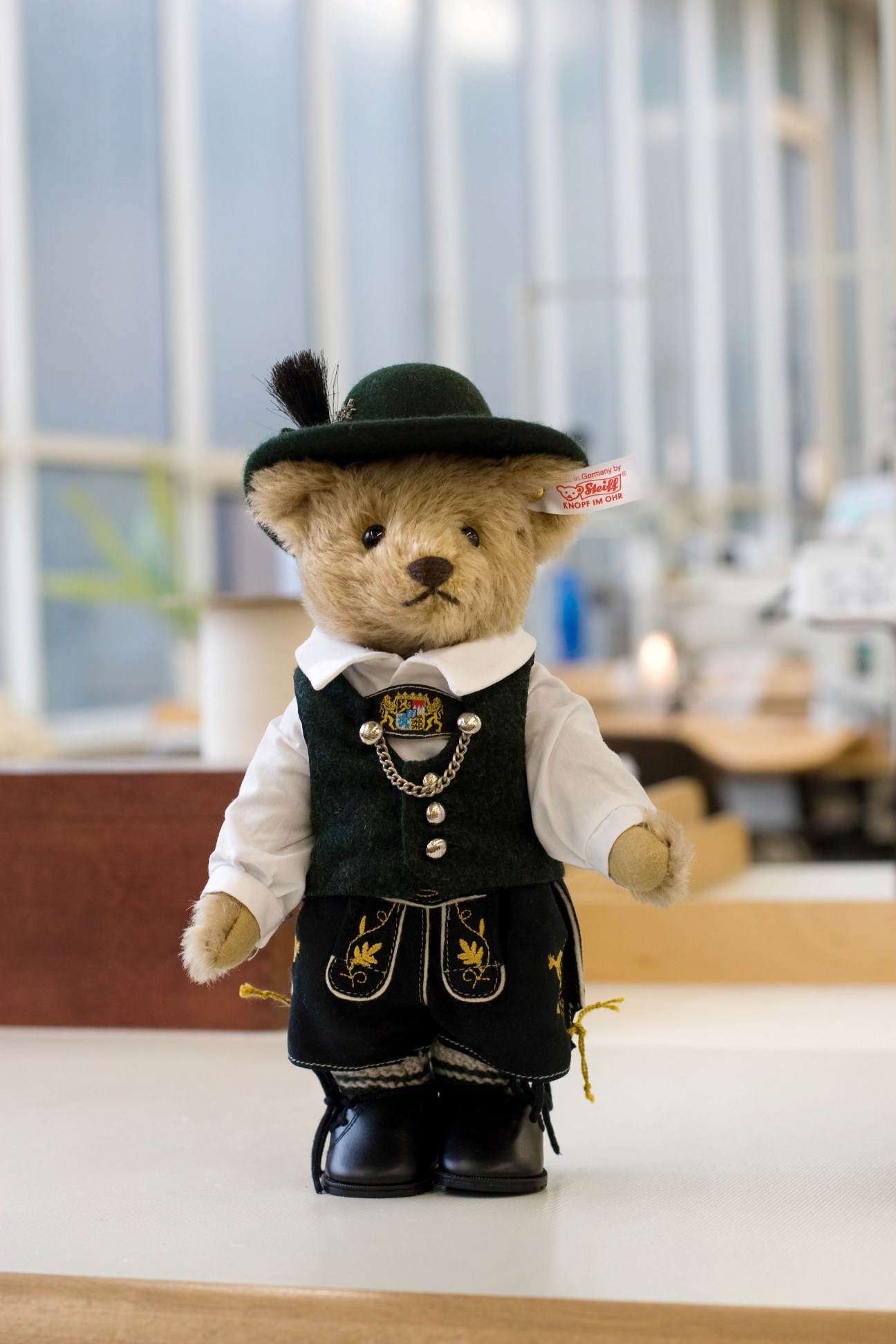 Steiff limited-edition teddy bear wearing traditional Bavarian costume with hat, vest and boots.