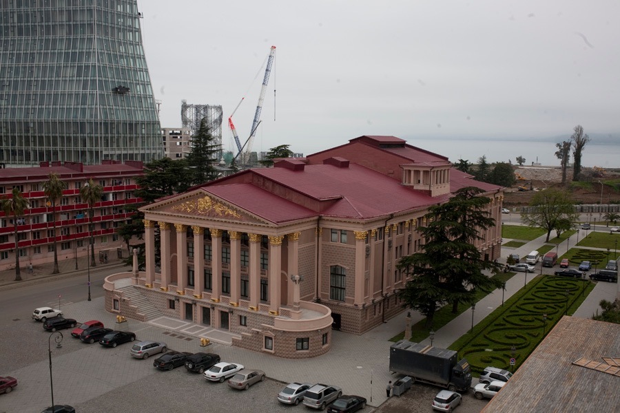 State Drama Theatre in Theatre Square, Batumi, featuring a neoclassical building with red roof and columns.