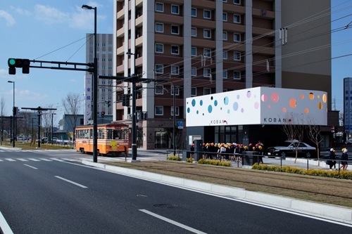 Modern concrete police box with laser-cut exterior patterns in Kumamoto, Japan, designed by Klein Dytham Architects.