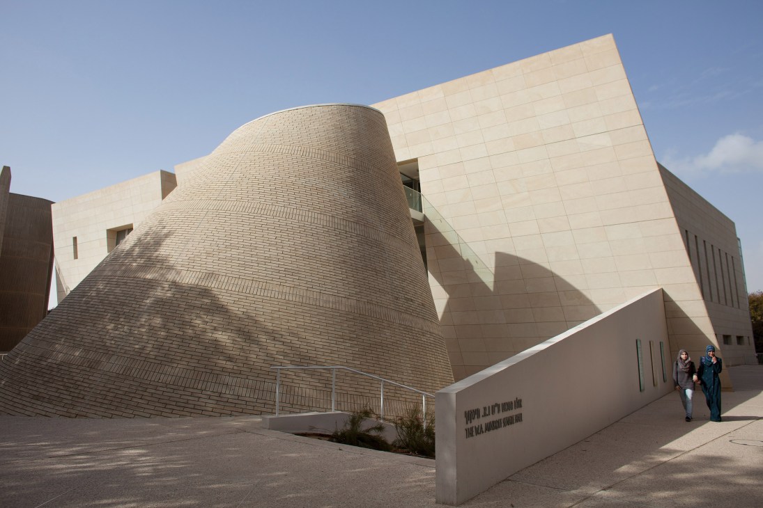 Two Israeli Arab women walk past the modern architecture of Ben-Gurion University in Be'er-Sheva.