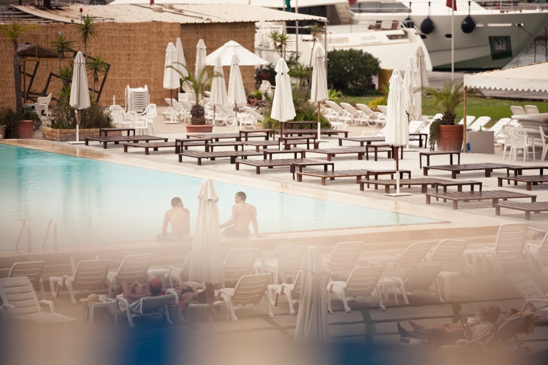 Saint George Beach Club pool with white umbrellas, loungers and Mediterranean views in Beirut.