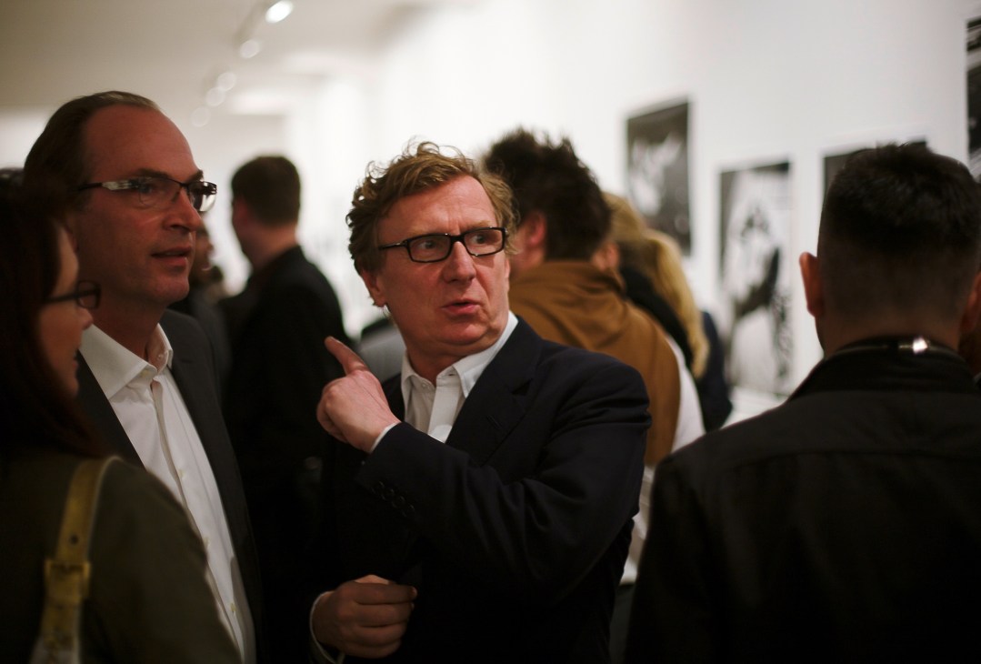 Gallerists conversing at the Jablonka Gallery during an art opening event in Berlin.