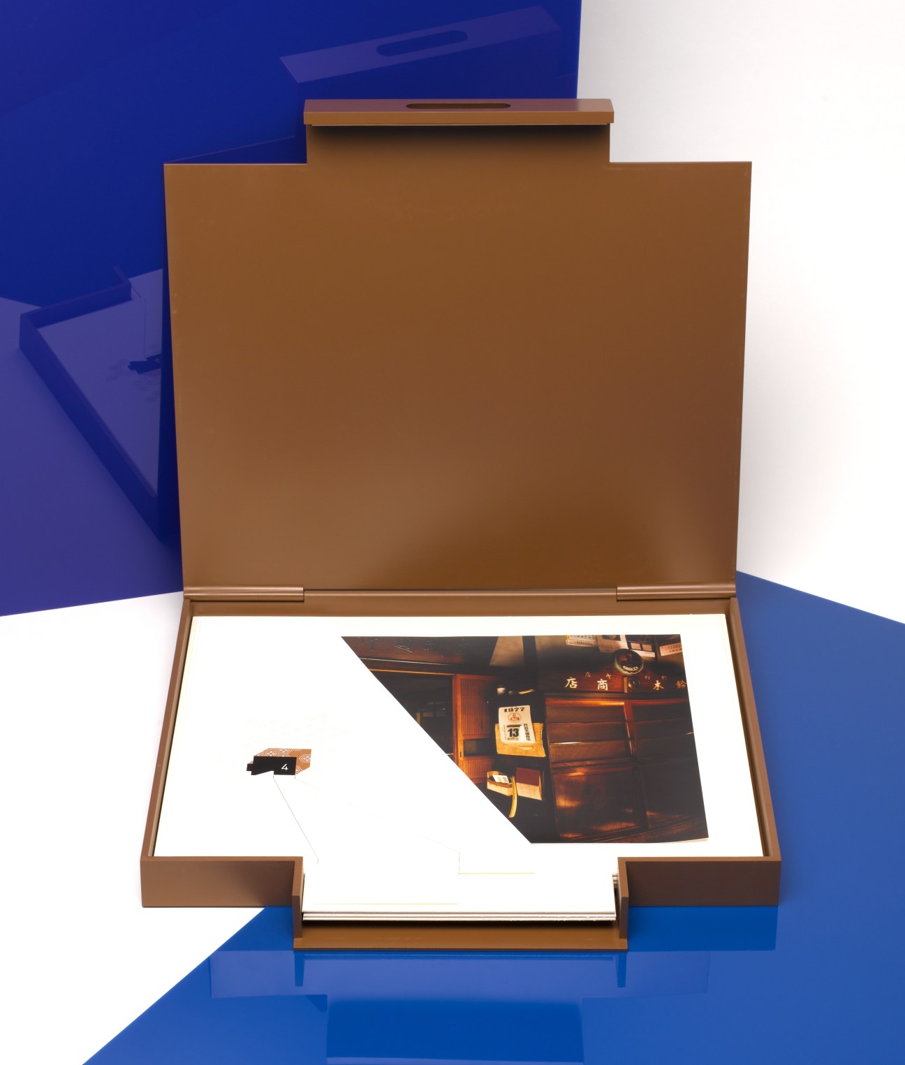 Toluca Editions box set containing six original signed photos by Yutaka Takanashi, displayed open.