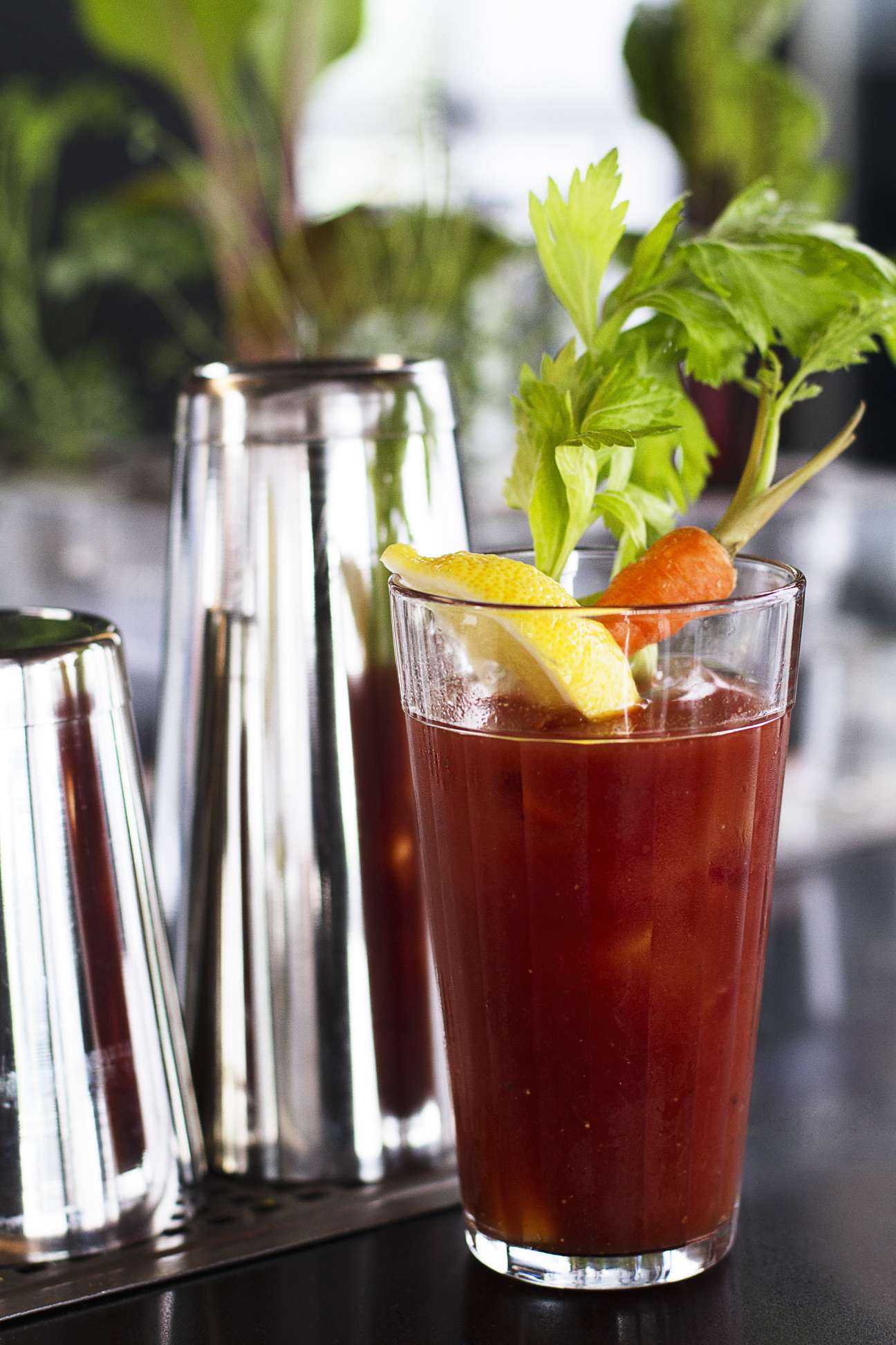 A Bloody Mary cocktail garnished with celery and citrus, served at Tuju restaurant in São Paulo.