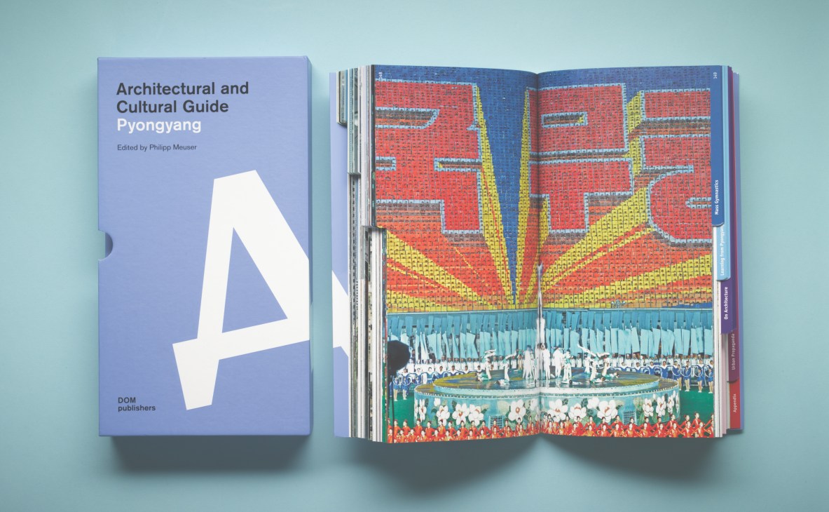 Pyongyang Architectural and Cultural Guide books by Philipp Meuser showing cover and interior pages with mass gymnastics imagery.
