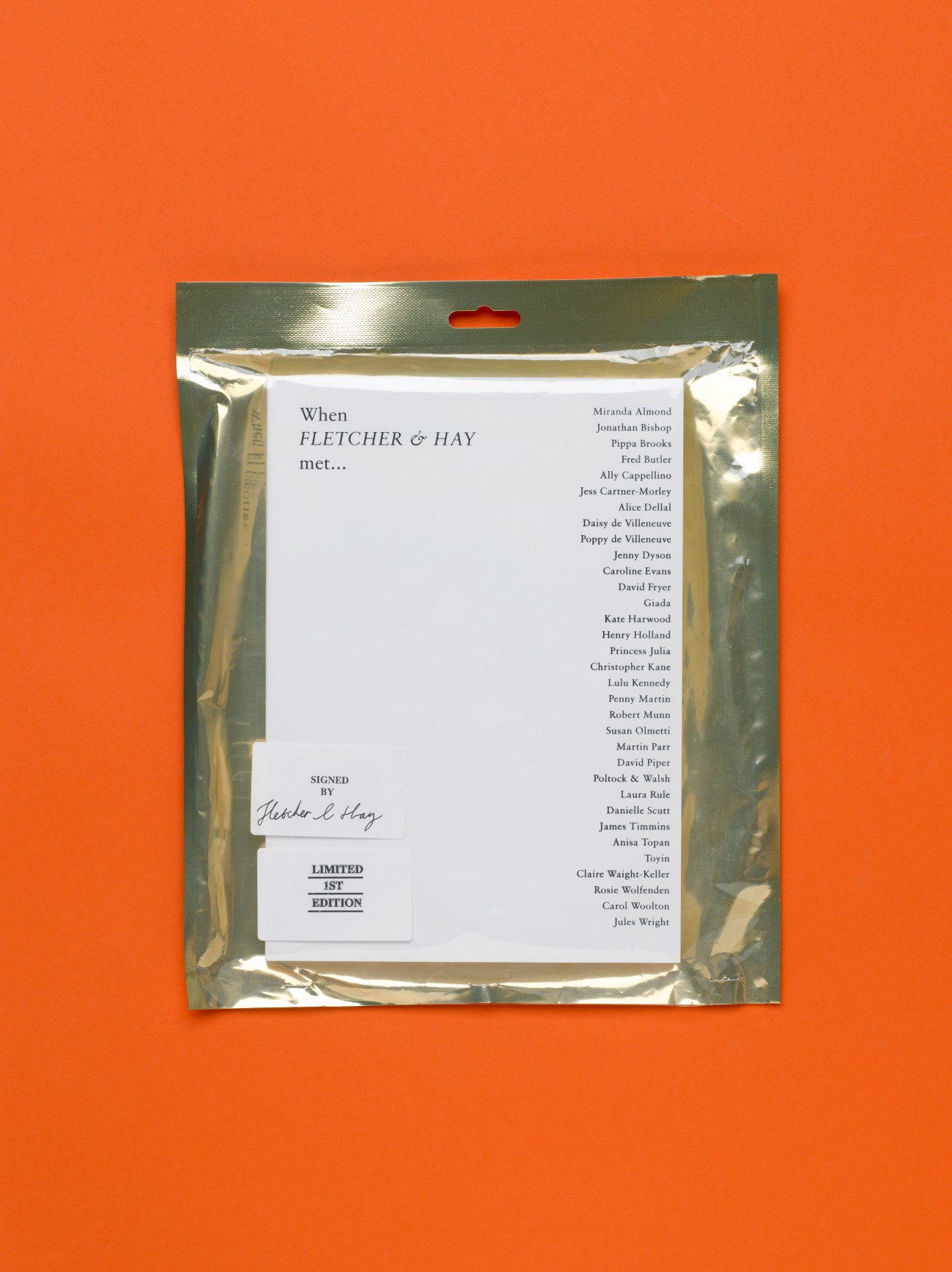 Packaged book cover for 'When Fletcher & Hay met...' with gold foil border against orange background.