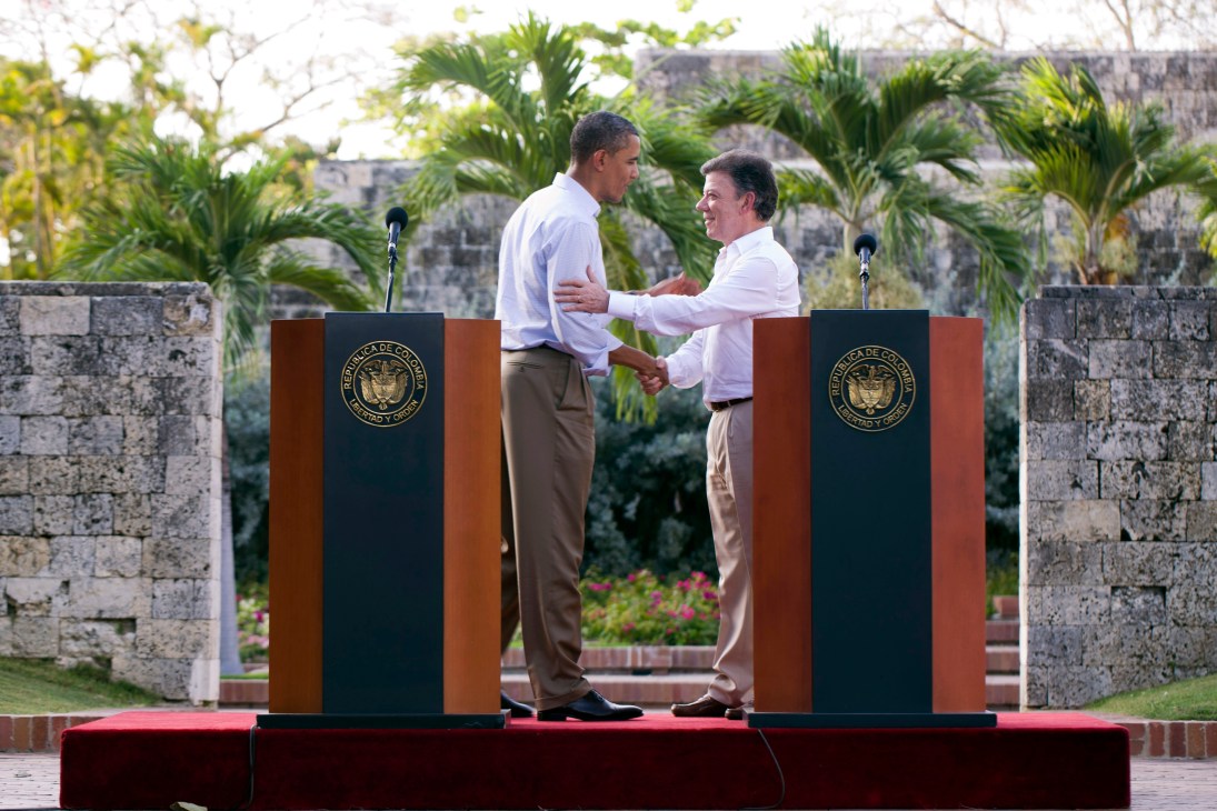 President Santos and Barack Obama shake hands at dual podiums during a bilateral meeting in Cartagena.