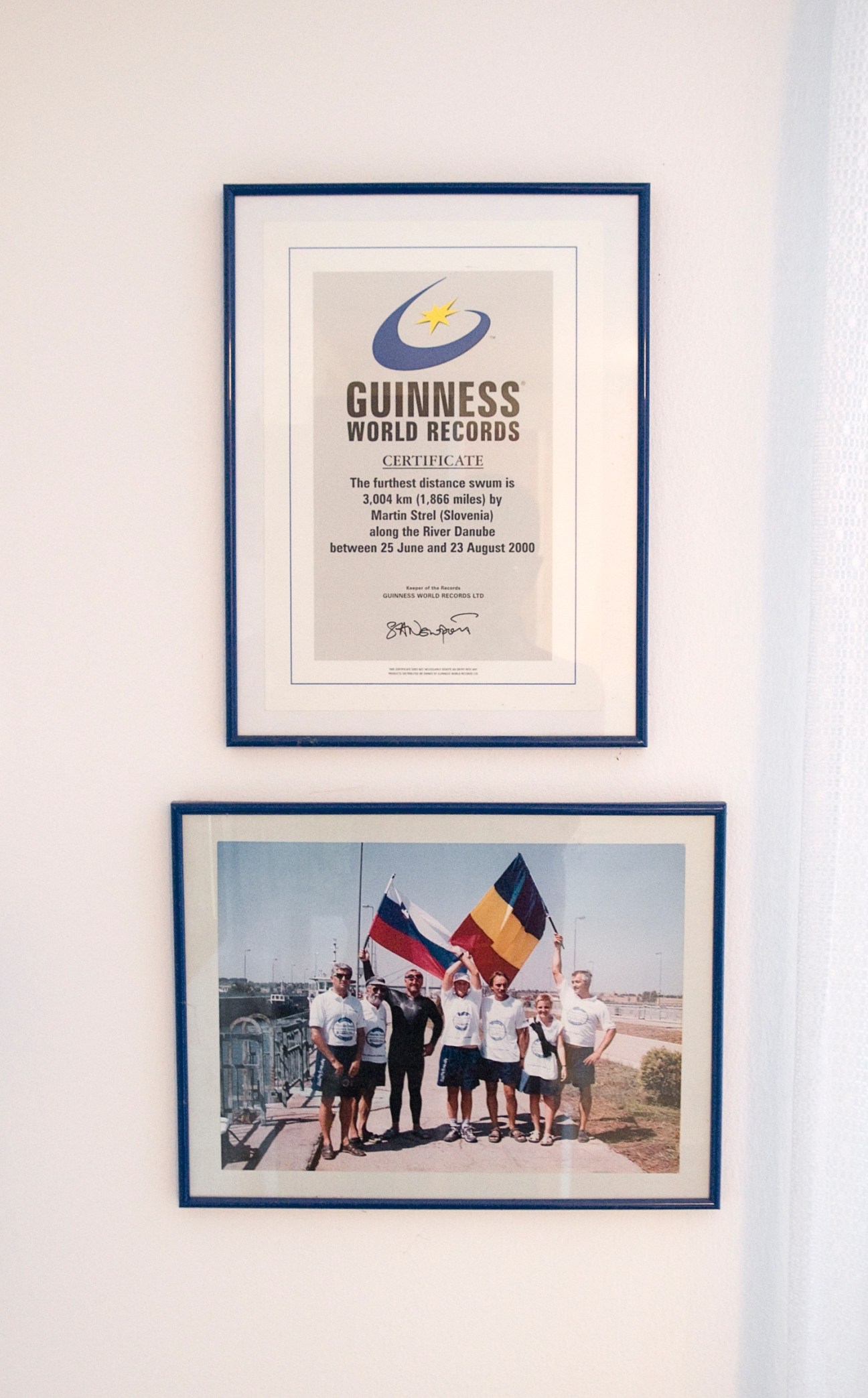 Framed Guinness World Records certificate and photograph documenting Martin Strel's Danube swim record.