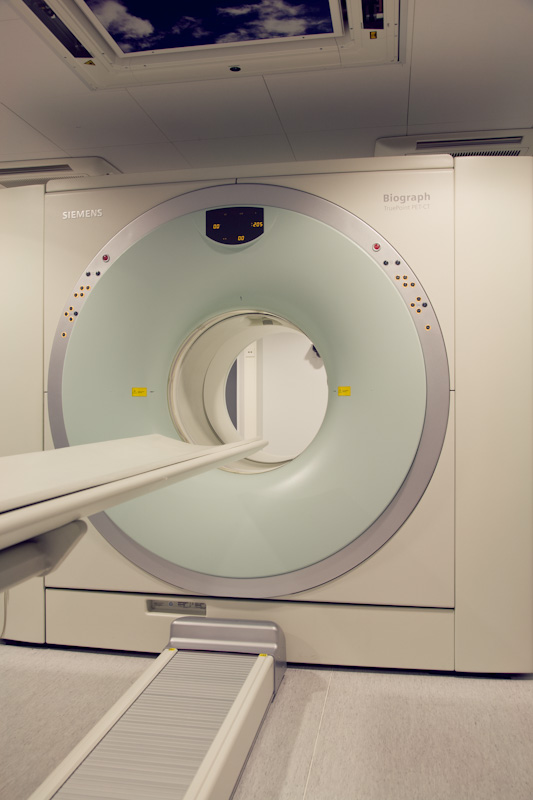 Siemens Biograph MRI scanner with white circular gantry and control panel